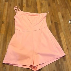 Beautiful small light coral pink “Superdown” romper never worn.